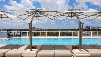 2 outdoor pools, open 7:00 AM to 9:00 PM, pool loungers
