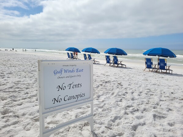 A beach sign indicating 'Private Property Gulf Winds East' with 'No Tents' and 'No Canopies' restrictions. - STEPS FROM PRIVATE GATED BEACH, RENOVATED 4 BEDRM w/ 2 BALCONIES & 2 PATIOS (Miramar Beach)