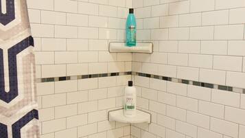 Combined shower/bathtub, hair dryer, towels, soap