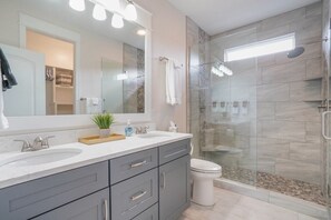 Combined shower/tub, hair dryer, towels, soap