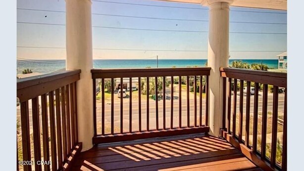 A balcony with a view of the beach and ocean. - ECDI | PCB Near 30-A 5BR 4BA Pool Hot Tub EV Charger Early Booking Discounts (Panama City Beach)