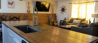 Spacious family home with luxe beds, fenced in back yard, heart of town!