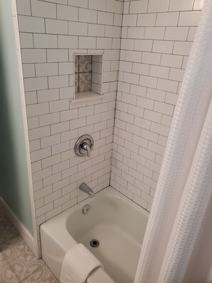 Combined shower/bathtub, hair dryer, towels, soap