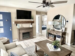 Smart TV, fireplace, books, music library