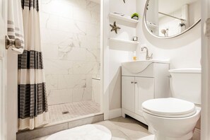 Shower, hair dryer, towels, soap