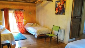 A cozy room with two beds, a chair, and a radiator. - La Maison d'Aum -Perigord Dordogne between Bergerac and Perigueux- 8pers-Pool (Bourrou)