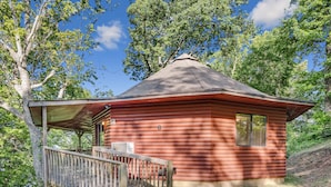 A log cabin with a covered porch and a small deck. - Carters Lake Lakeview Cabin #6 includes free boat slip at the Marina (Ellijay)