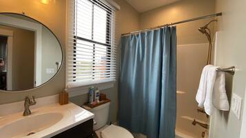 Combined shower/tub, hair dryer, towels, soap