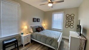 A bedroom with a bed, nightstands, a desk, a ceiling fan, and a TV. - Newer Build-Just a Block to Main St.-Mountain Views (Buena Vista)