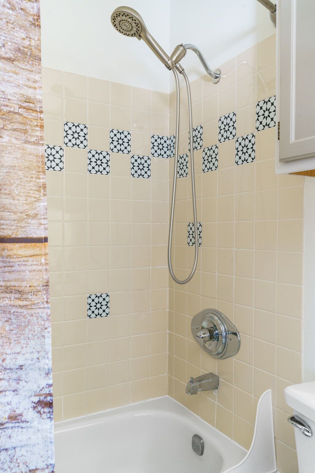 A bathroom with a shower, a bathtub, and a toilet.