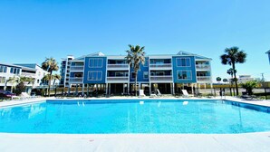 A swimming pool with a clear blue sky above.
