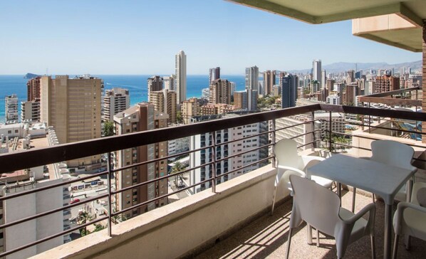 A balcony with a view of a cityscape and the ocean. - AQUARIUM II 19-3 (BENIDORM)
