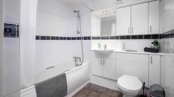 Combined shower/bathtub, hair dryer, towels, soap