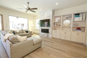 Smart TV, fireplace, books, offices