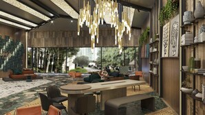 Un interior moderno con zona de comedor central, arreglos de asientos y elementos decorativos.
