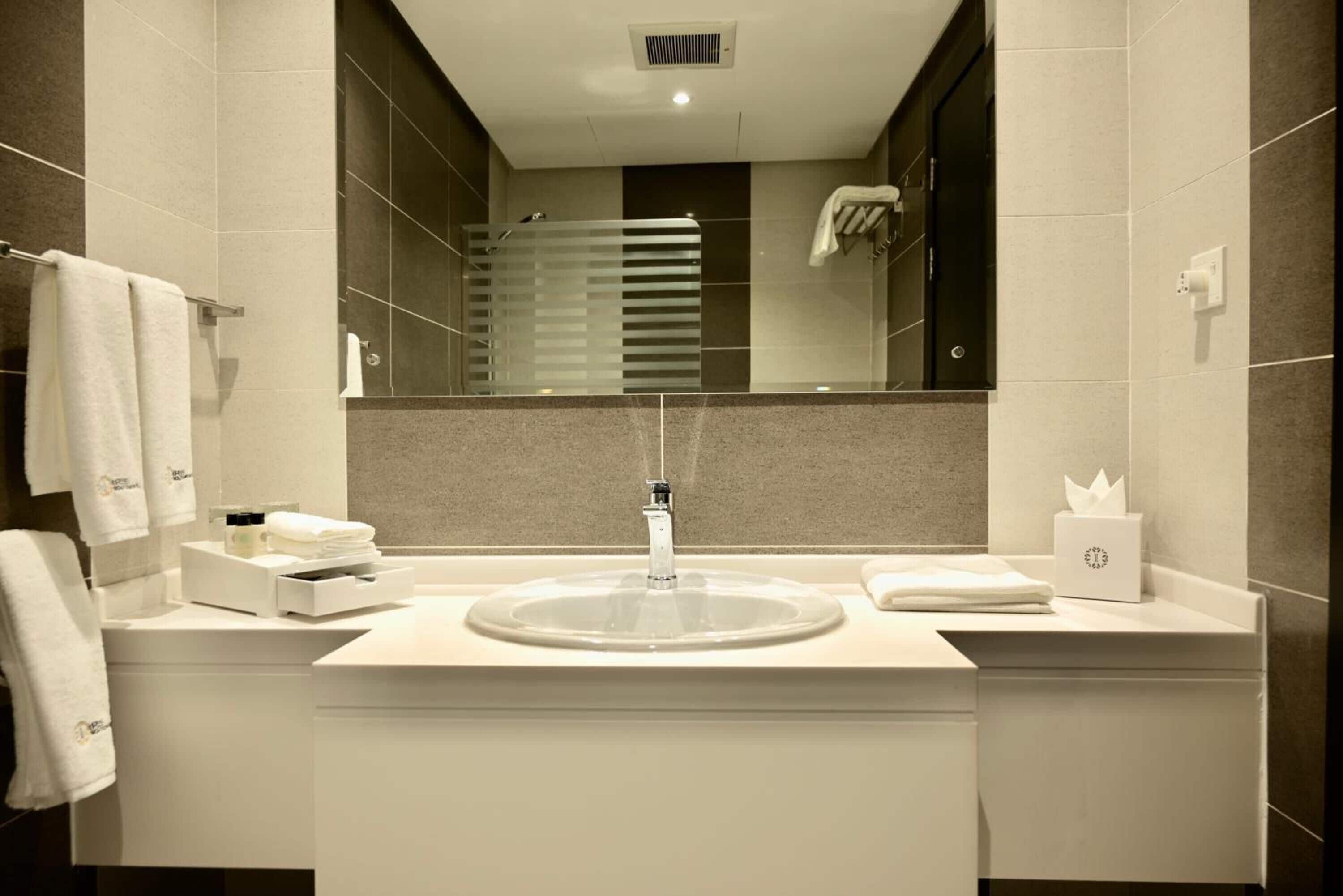 rainfall showerhead, designer toiletries, hair dryer, bathrobes