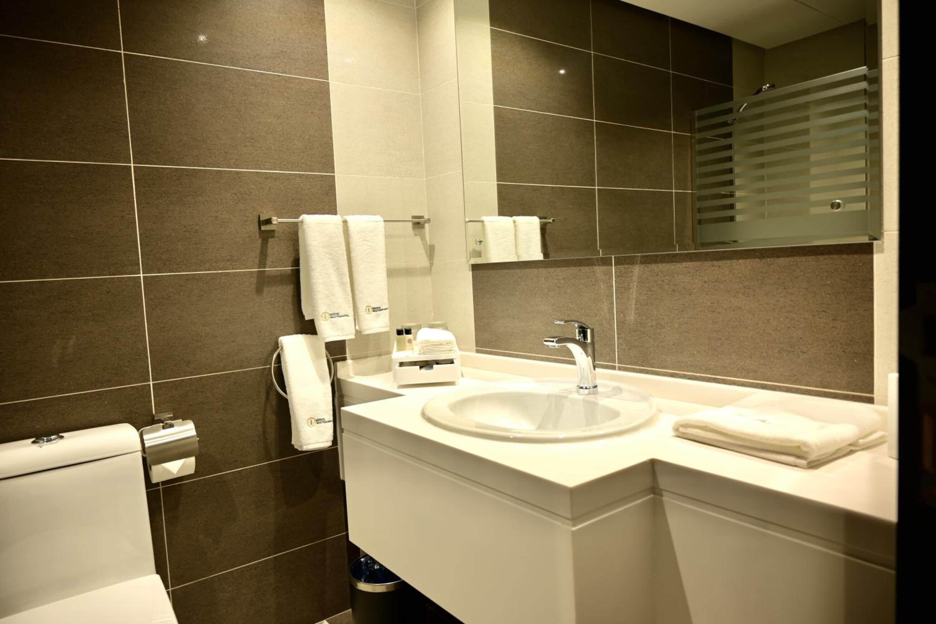 rainfall showerhead, designer toiletries, hair dryer, bathrobes