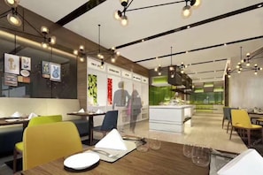 A modern restaurant interior with multiple dining tables, chairs, and pendant lighting. - Hampton By Hilton Nanjing South Railway Station (Nanjing)
