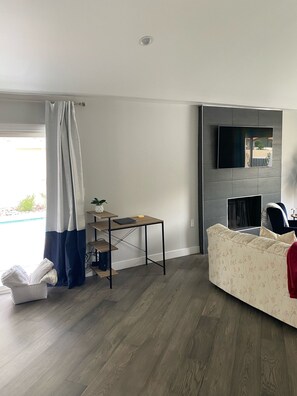 Smart TV, fireplace, books