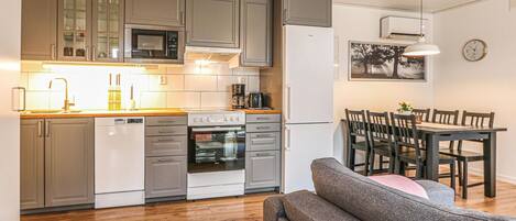 Fridge, stovetop, dishwasher, coffee/tea maker