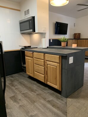 Fridge, microwave, stovetop, coffee/tea maker