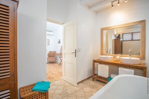 Bathtub, hair dryer, towels, soap