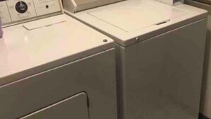 A laundry room with two stacked front-loading washing machines. - Cozy, Clean!  Pets Welcome..Close to Walking/Bike Trail (Aberdeen)
