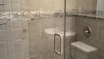 Shower, hair dryer, towels, toilet paper
