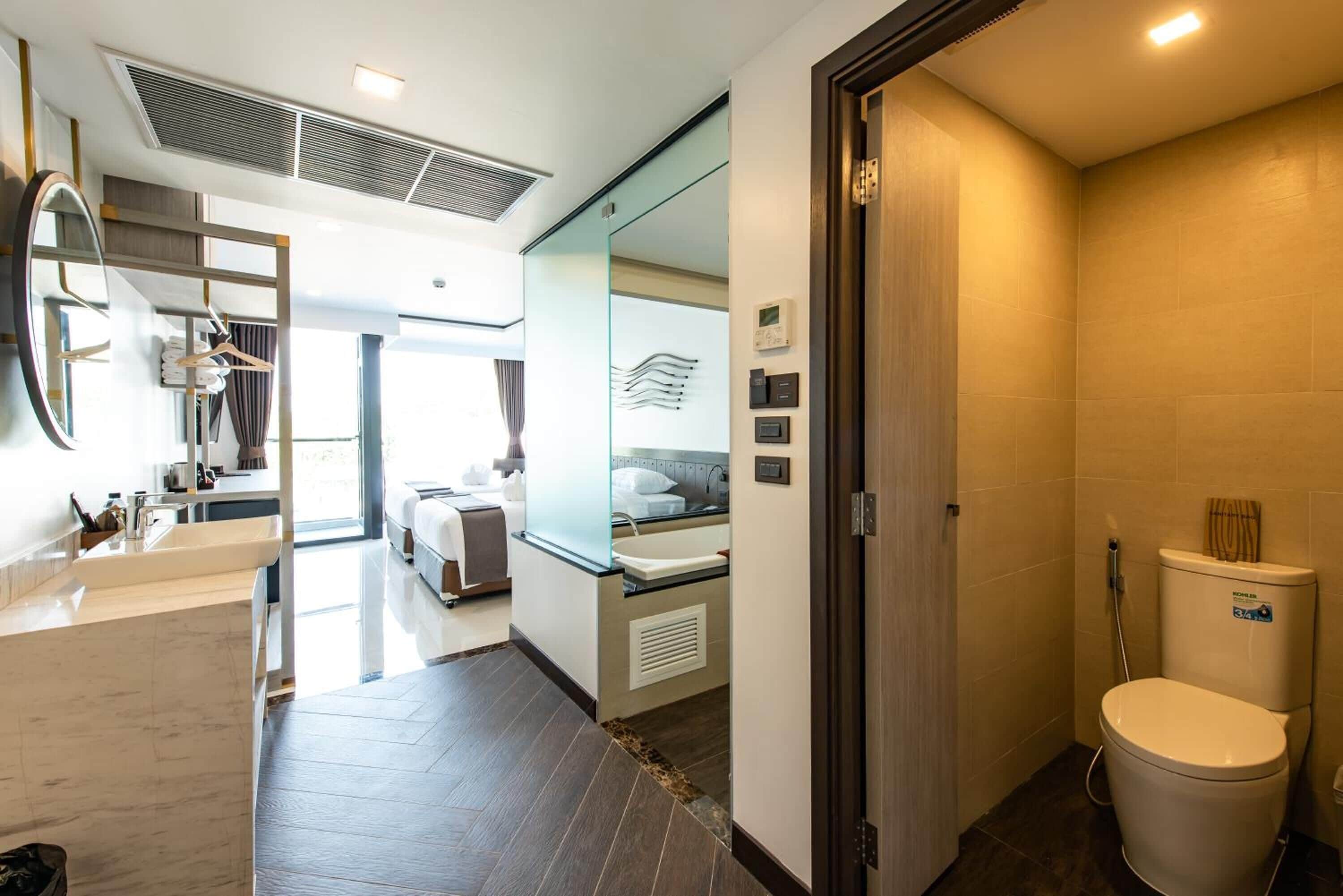 separate bathtub and shower, free toiletries, hair dryer, bathrobes