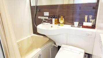 Combined shower/tub, free toiletries, hair dryer, slippers