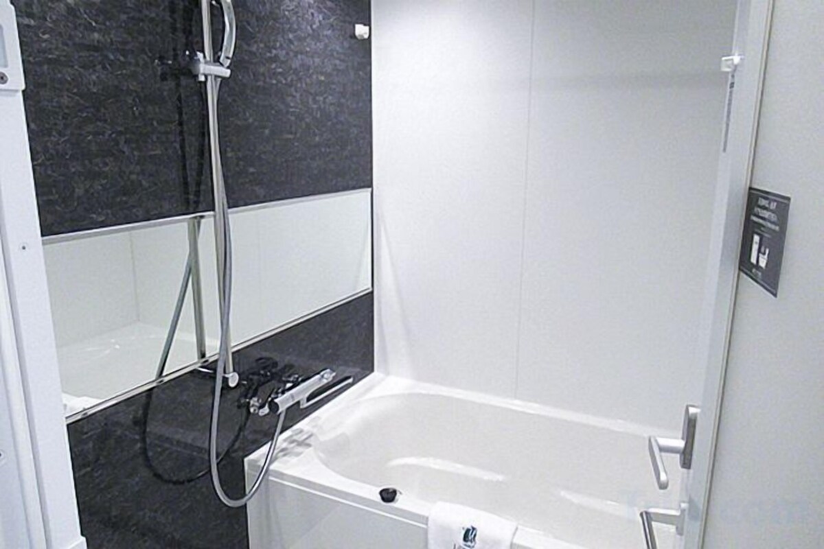 Bathroom | Combined shower/bathtub, free toiletries, hair dryer, slippers