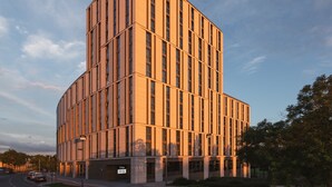 A modern building with a rectangular shape and vertical windows. - Holiday Inn - the niu, Tab Dusseldorf Main Station by IHG (Düsseldorf)