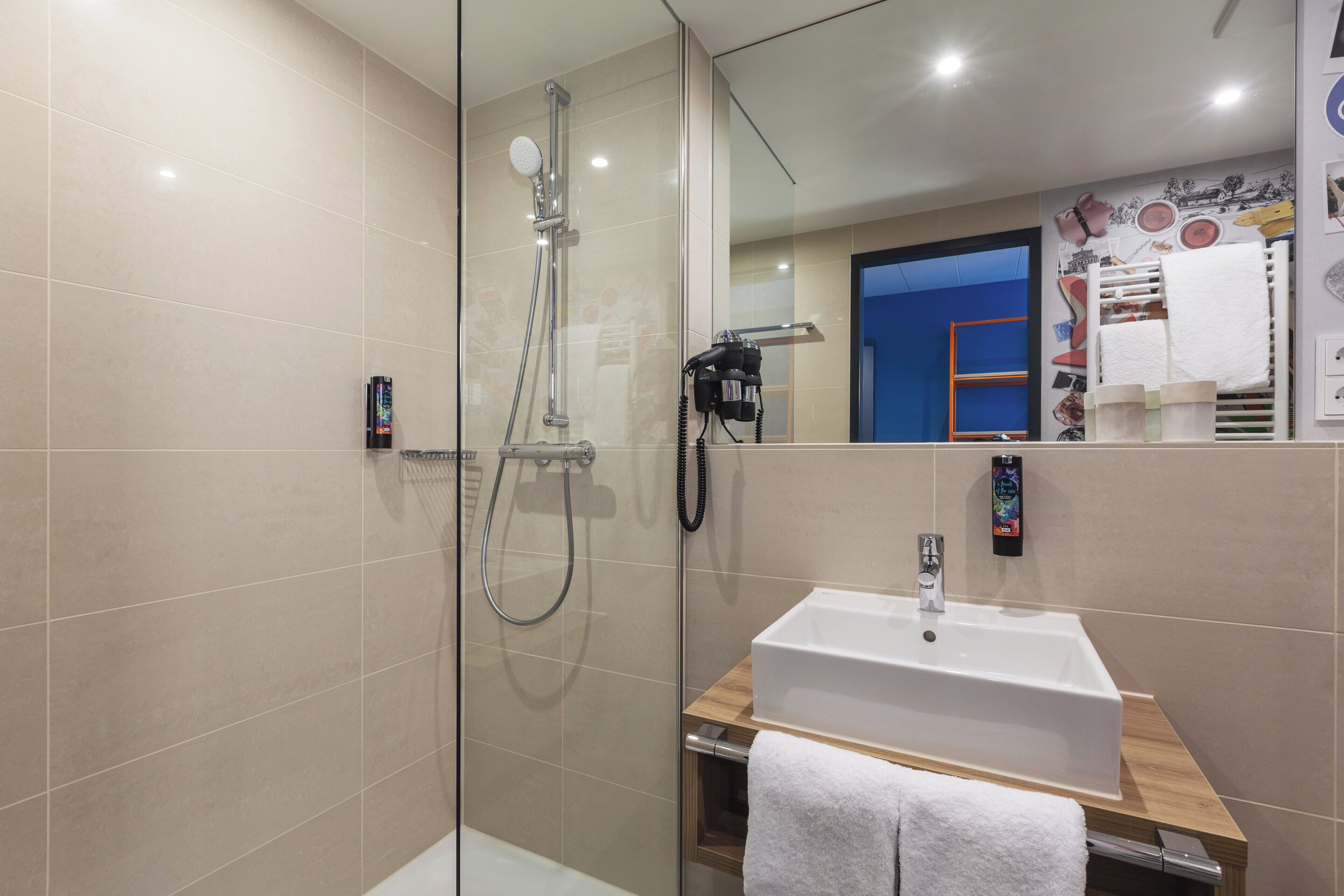 shower, free toiletries, hair dryer, towels