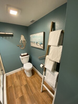 Shower, rainfall showerhead, hair dryer, towels