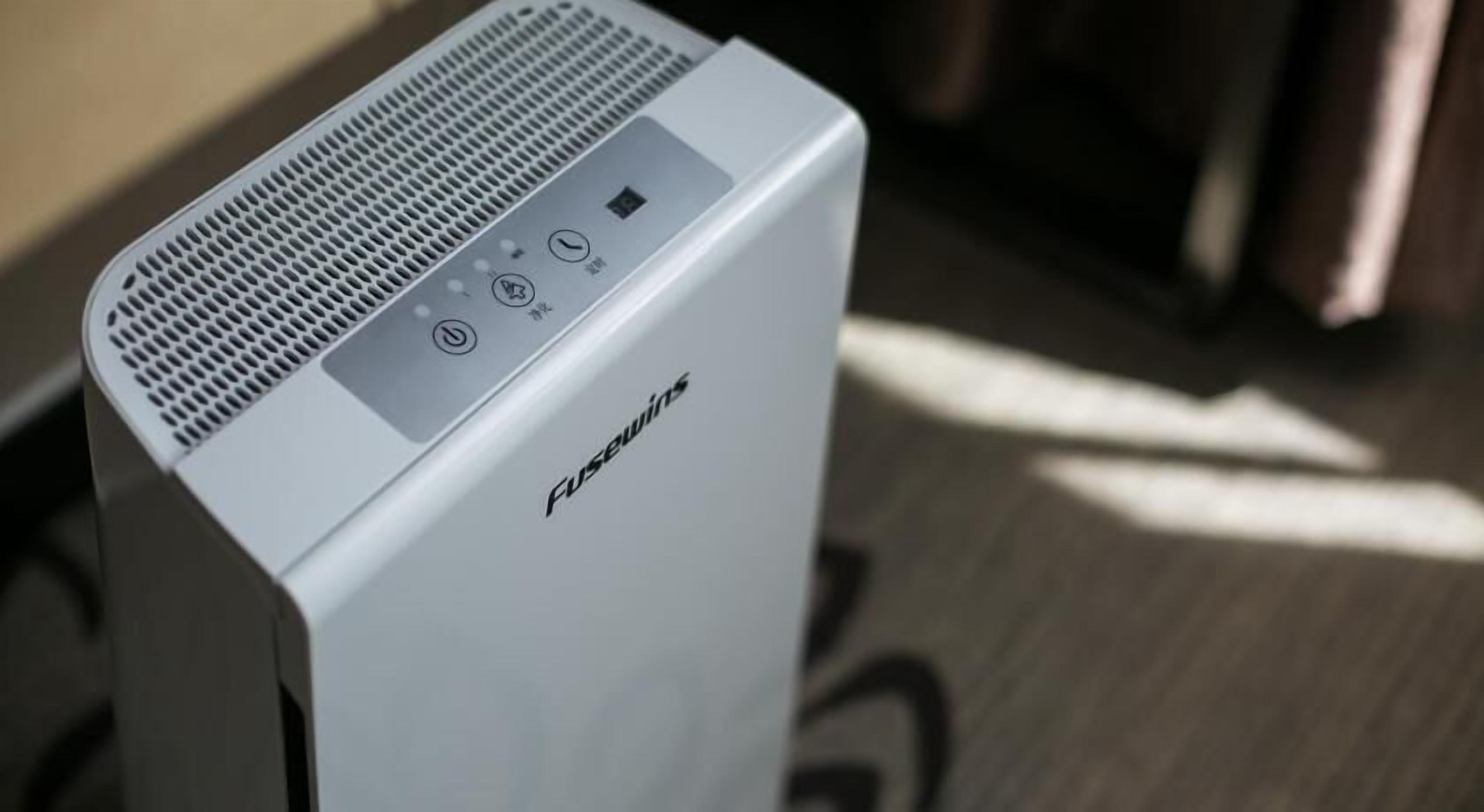 A white FUSEWINS device with a control panel, including a power button, volume control, and a mute switch.