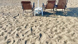 A beach umbrella with a number 401, two beach chairs, and a sandy beach with a clear view of the ocean. - Villasonboard Dock Villa 3bed Sleeps8 Porto Hydra (Ermionida)
