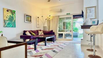 Villa | Living area | 30-inch TV with cable channels, fireplace