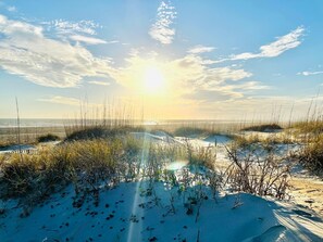 A beach with sand dunes and sparse vegetation under a clear sky. - 3 Bed/2.5 Bath 1450 sq ft with Large Open Floor Plan, 3 Min Walk to Beach (Emerald Isle)
