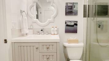 Shower, hair dryer, towels, soap