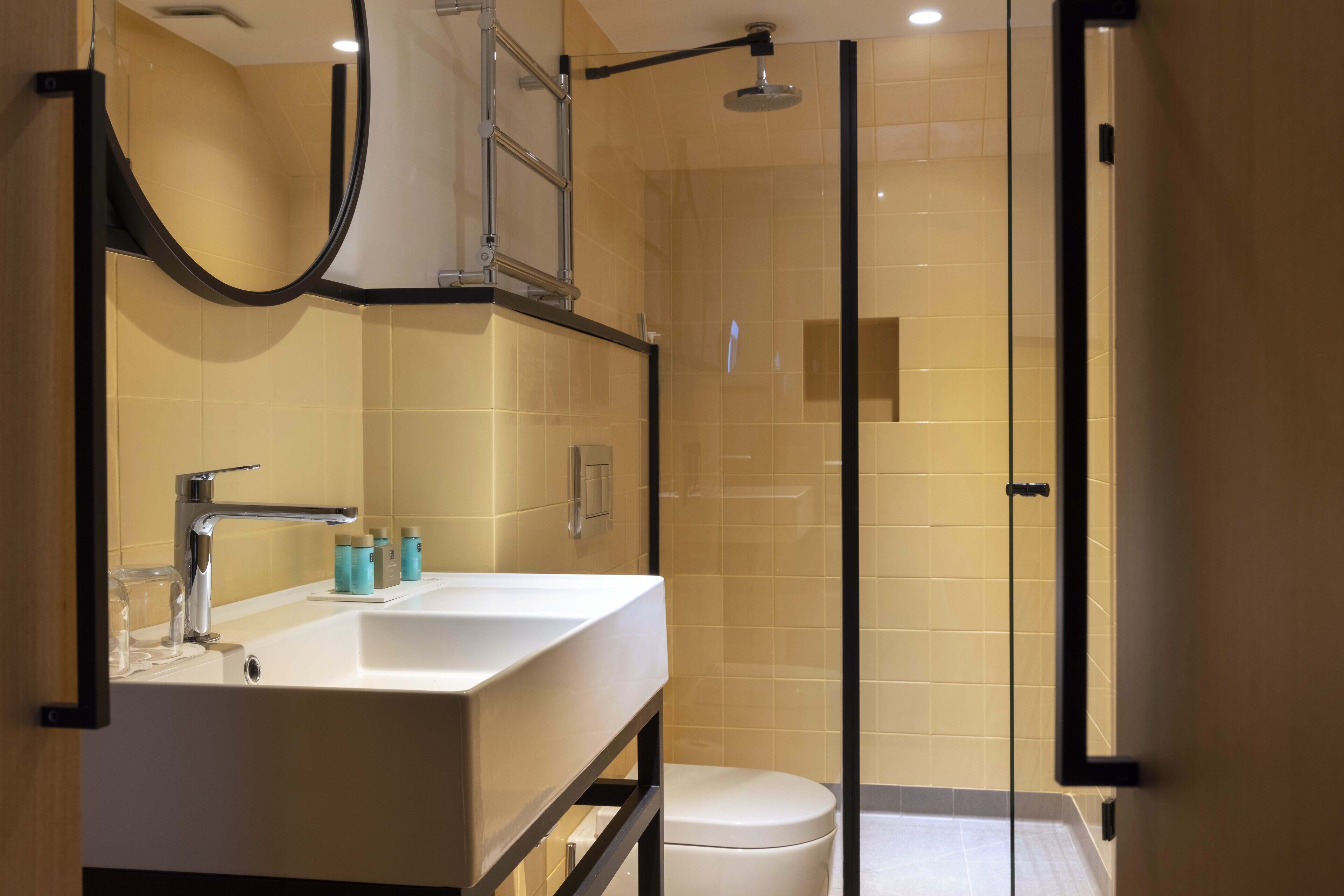 deluxe room | bathroom | shower, designer toiletries, hair dryer, bathrobes