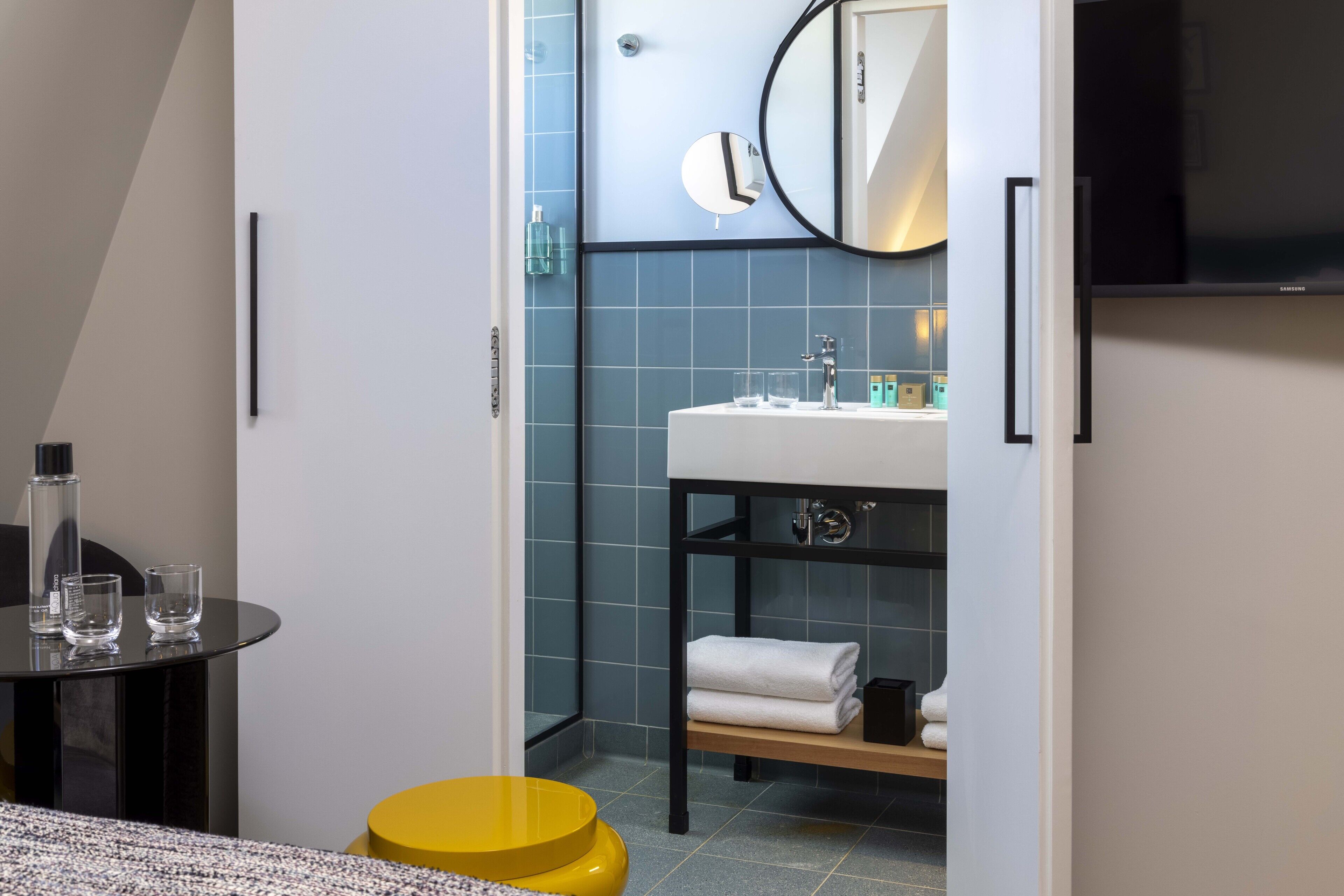 deluxe room | bathroom | shower, designer toiletries, hair dryer, bathrobes