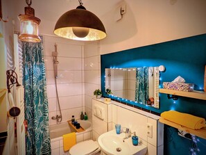 Combined shower/tub, hair dryer, towels, soap