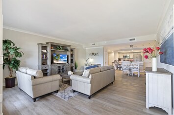 Updated and spacious living room with coastal furnishings