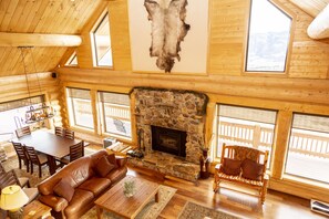 Cozy up by the fireplace, surrounded by stunning views of the surrounding landscape.