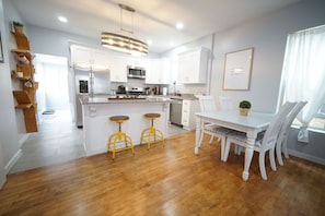 A beautiful open kitchen design encourages together time!