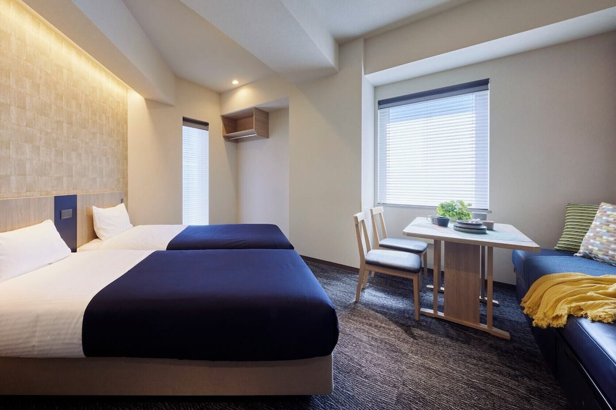 Standard Family Room (For 3-4 People), Non Smoking | Down duvets, in-room safe, blackout curtains, iron/ironing board