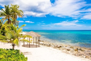 On the beach, sun-loungers