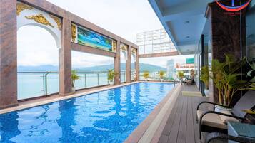 Outdoor pool, open 6:00 AM to 8:00 PM, sun loungers
