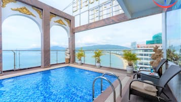 Outdoor pool, open 6:00 AM to 8:00 PM, pool loungers