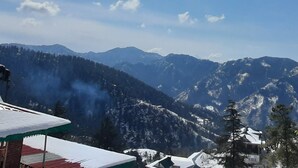 A mountain landscape with snow-covered peaks and a clear sky. - Newly built bnb in a pristine village (Shimla)